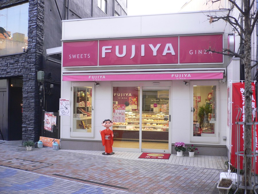 Peko-chan at the door of a Fujiya shop